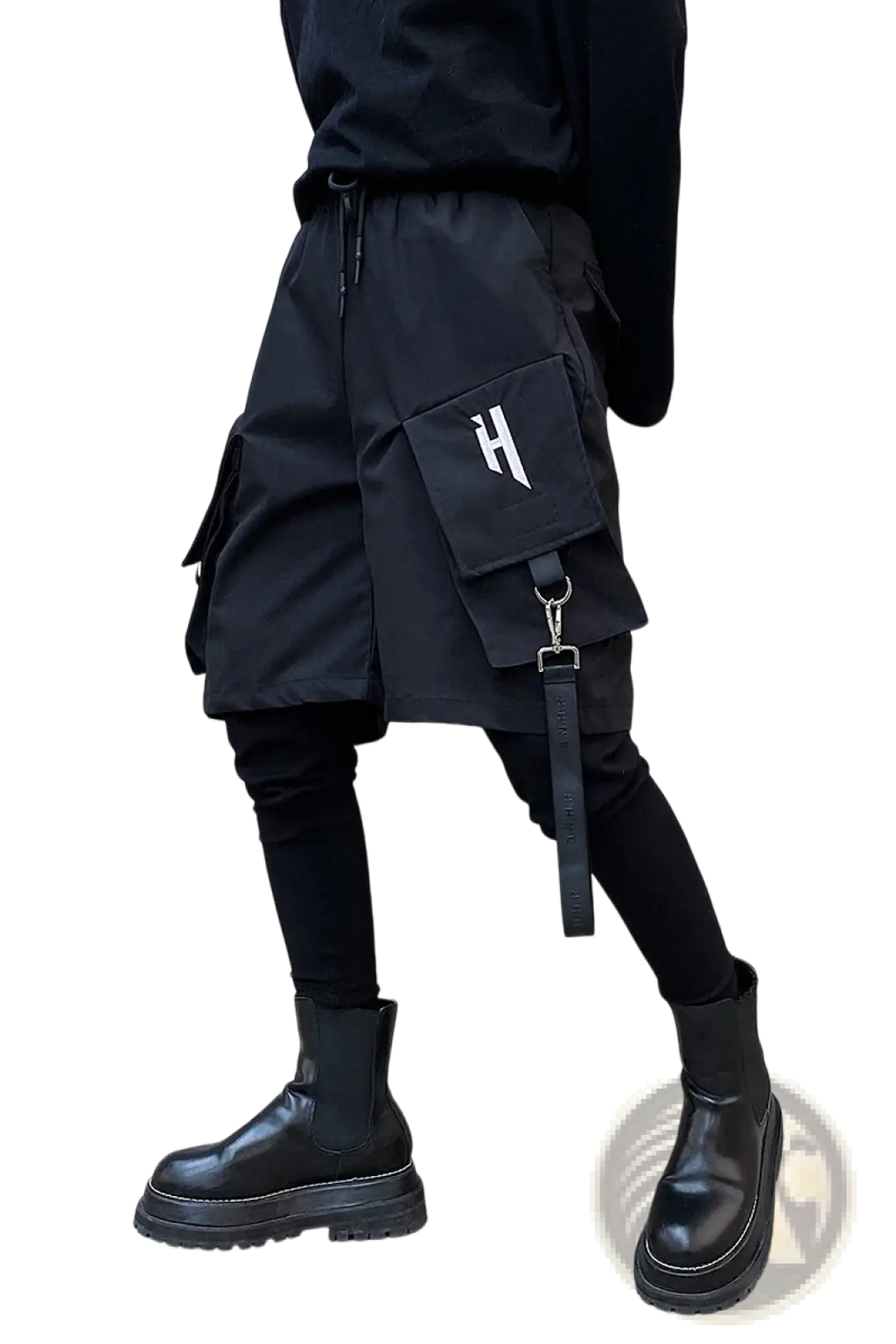 Black cargo shorts with detachable strap and white h logo on front pocket designed for hip hop style and utility