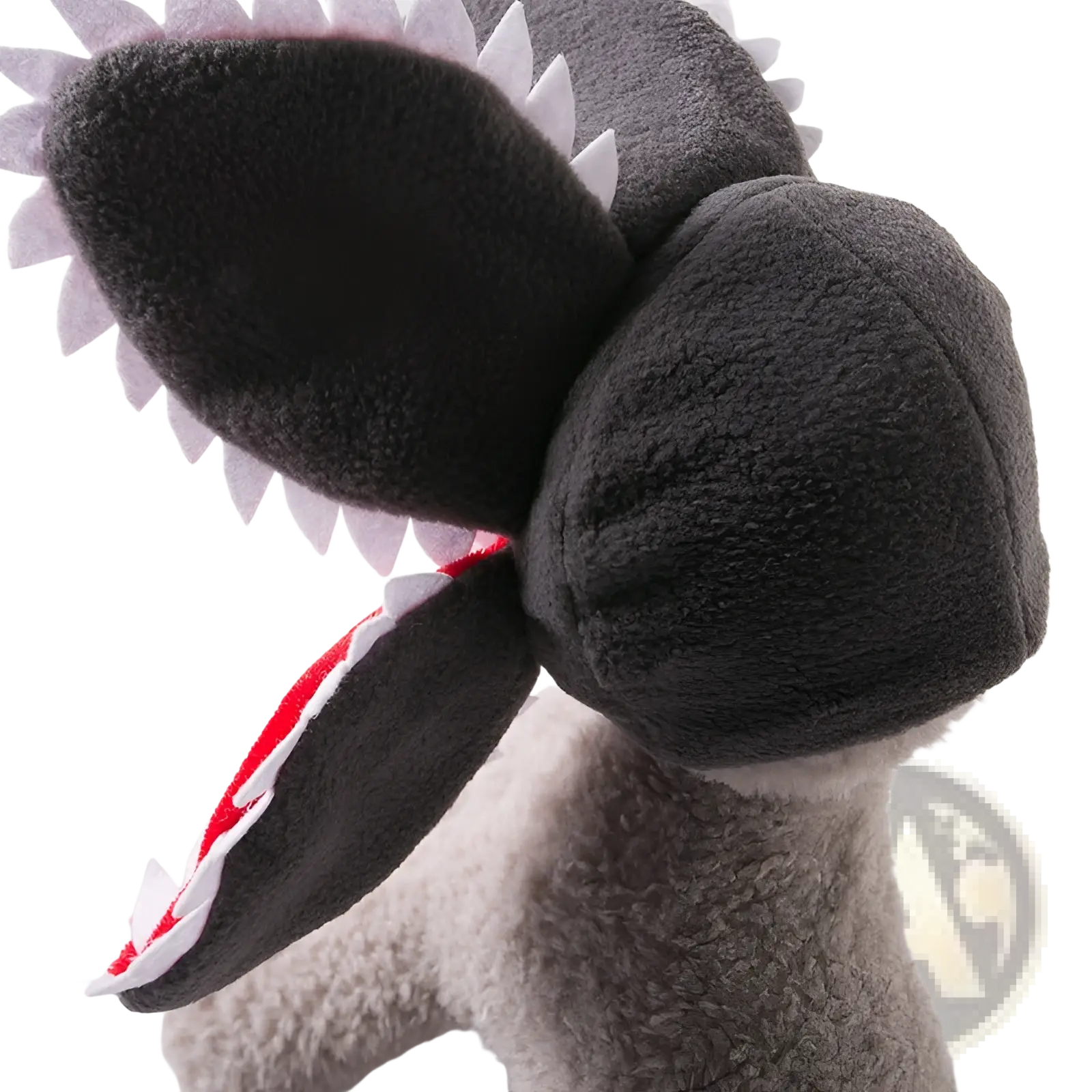 A plush gray shark toy with white triangular teeth and red and white striped inner mouth for carnivorous flower dog hat costume