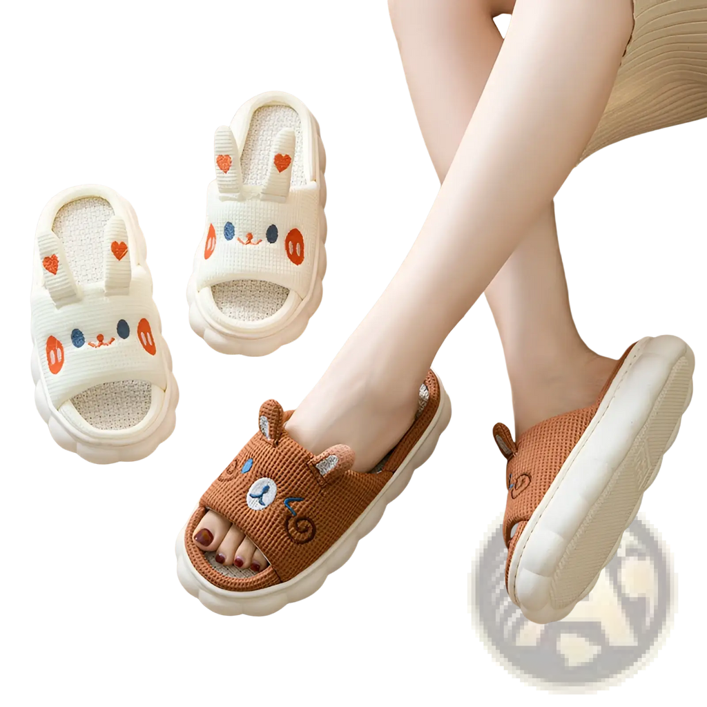 Cream-colored and brown linen slip-on slippers with embroidered bunny and bear faces and heart details for indoor wear