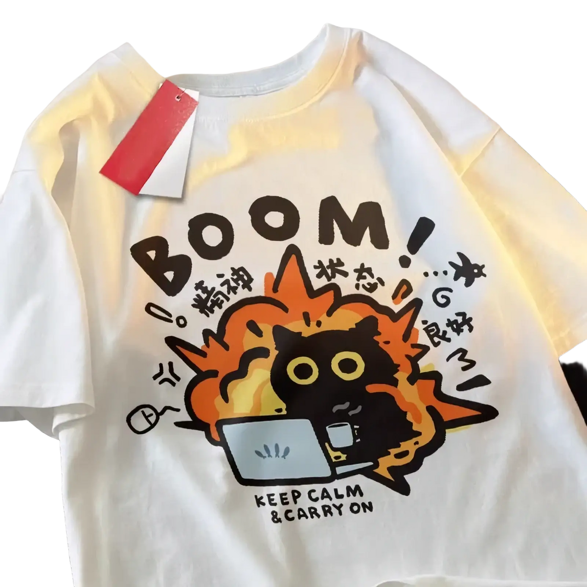 White cotton oversized t-shirt featuring a cartoon black cat with orange flames and bold brown text boom keep calm carry on