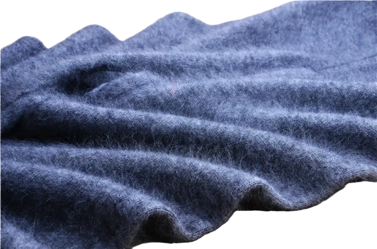 A soft deep blue woolen scarf with a plush texture and folds displayed alongside cashmere knit winter leggings