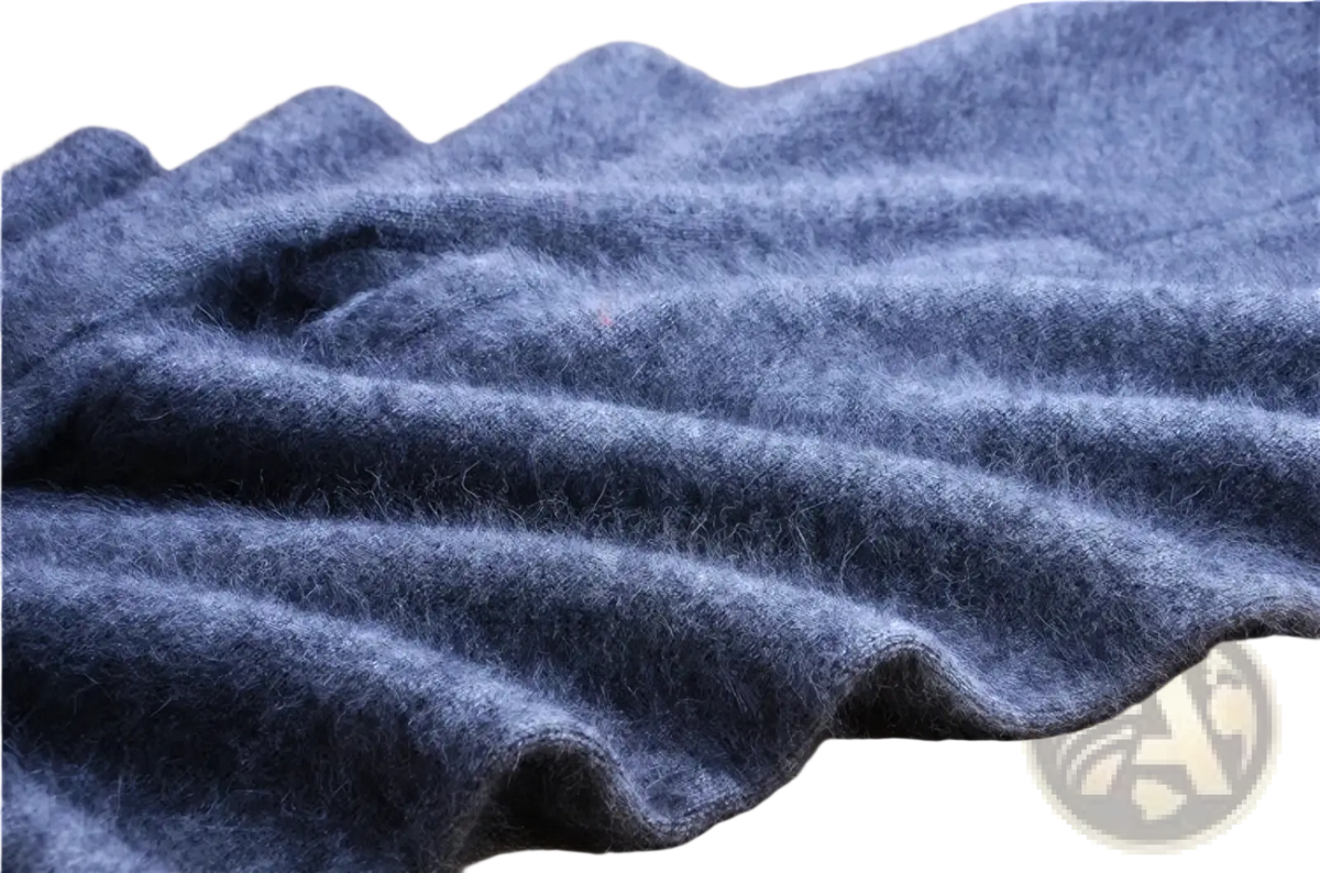 A soft deep blue woolen scarf with a plush texture and folds displayed alongside cashmere knit winter leggings
