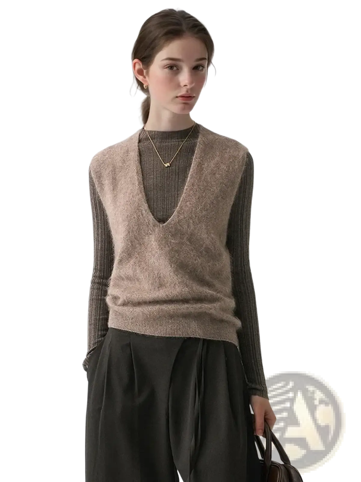 A soft beige cashmere wool v-neck sweater vest with a fuzzy knit texture worn over a ribbed long-sleeve top