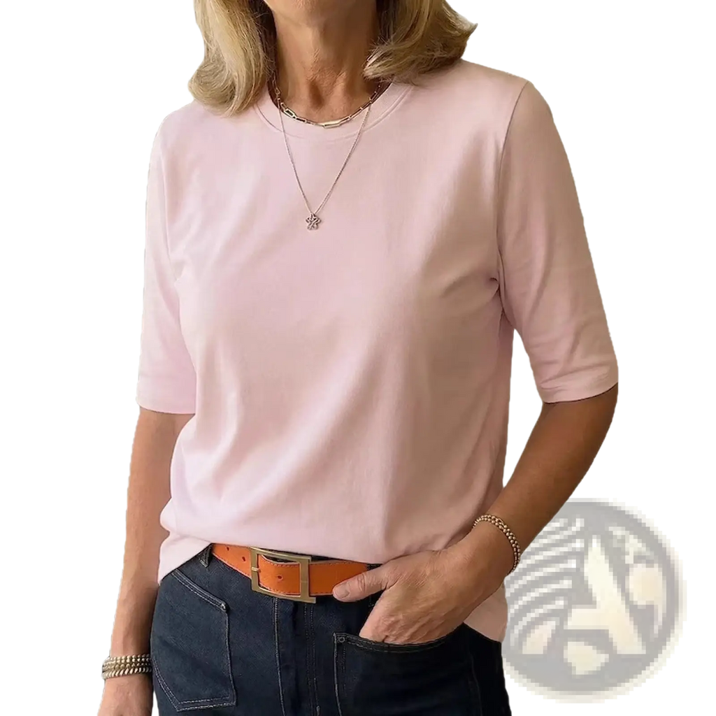 A soft pink casual crew neck pullover top with short sleeves and a relaxed fit made for everyday wear