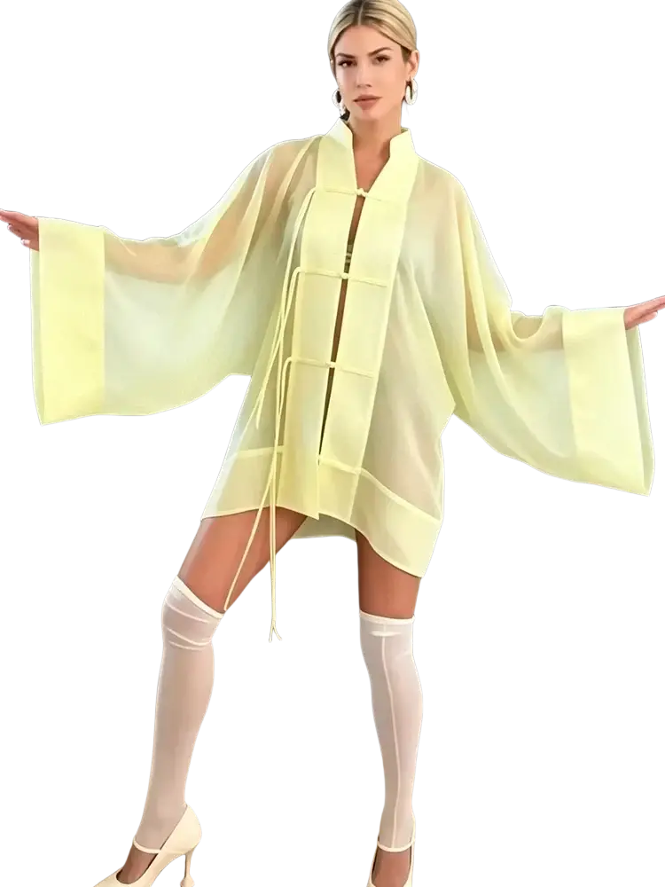 A flowing pale yellow sheer kimono-style casual shirt with wide sleeves and front tie closure for long sleeve blouse