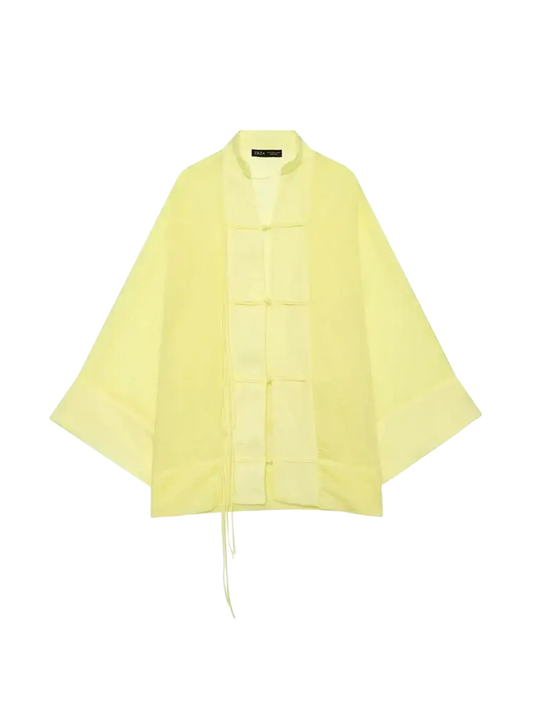 A pale yellow sheer long sleeve blouse with wide sleeves and drawstring hem in casual shirts style