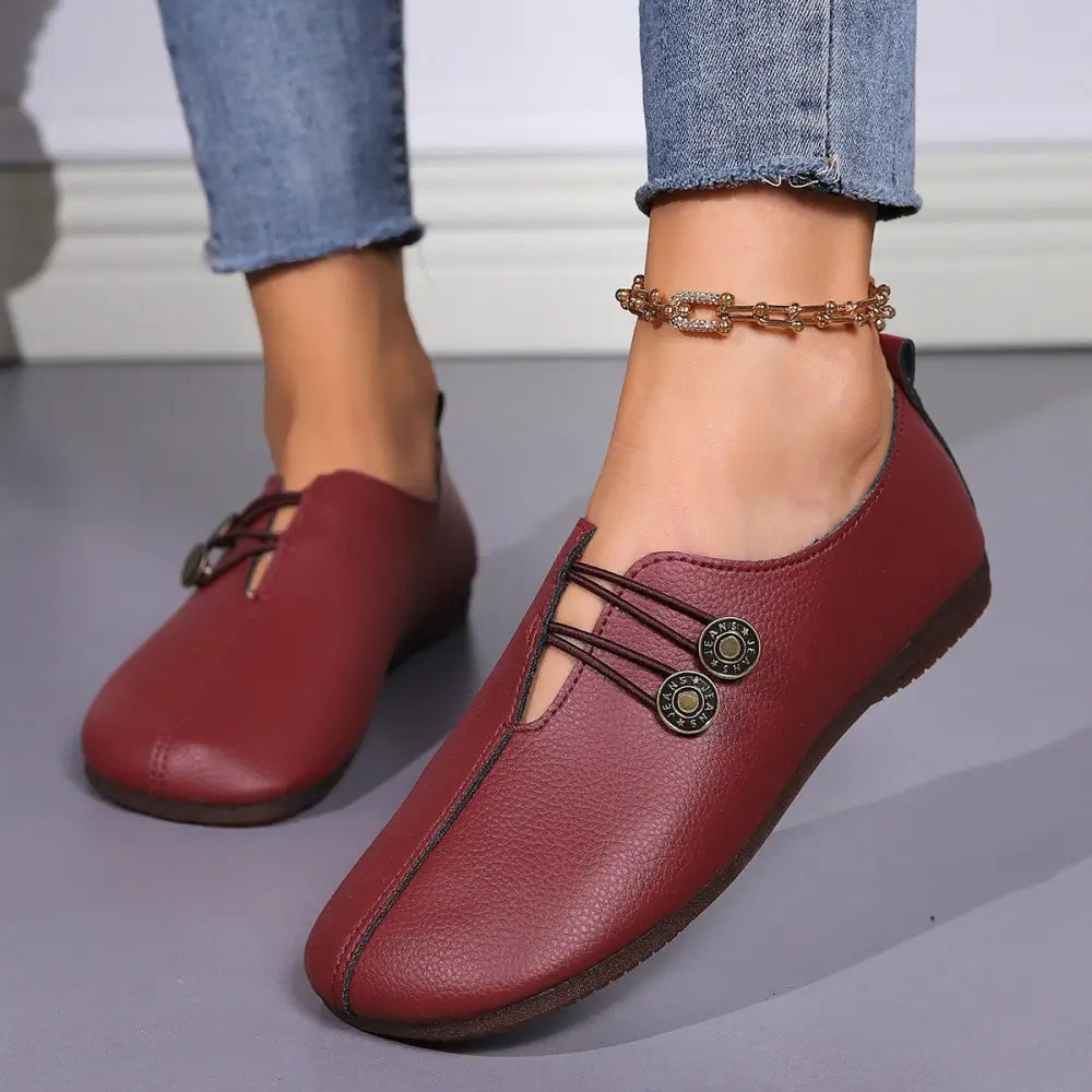 Burgundy leather women’s square toe lace-up flats with decorative metal buttons and button loafer style