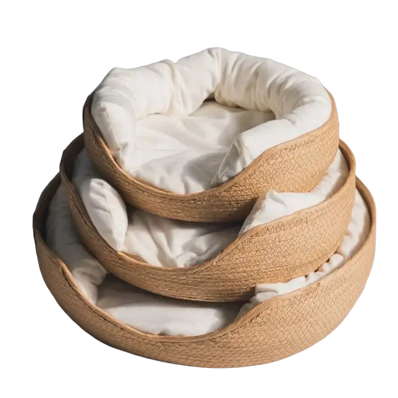 Stacked woven paper rope cat beds with soft white cushioning designed as comfortable sleeping bags