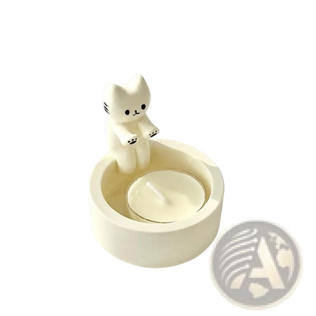 White ceramic cat candlestick holder with kitten figurine perched on circular tea light stand with candle inside