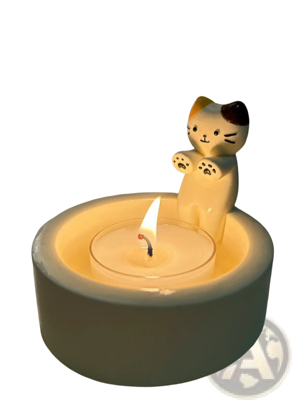 Cream-colored ceramic cat candlestick holder with a lit tea light inside for decorative lighting