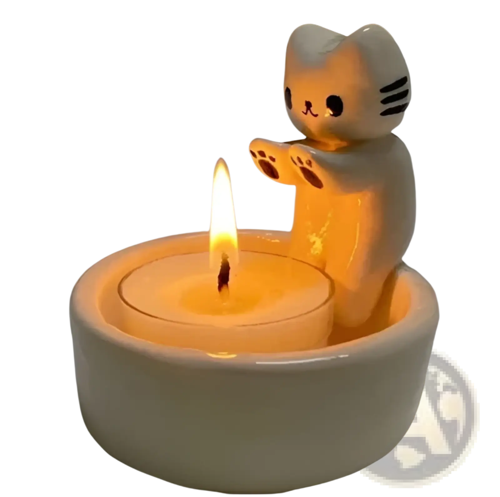 A white ceramic cat candlestick holder with black whiskers and paw prints holding a lit tealight candle