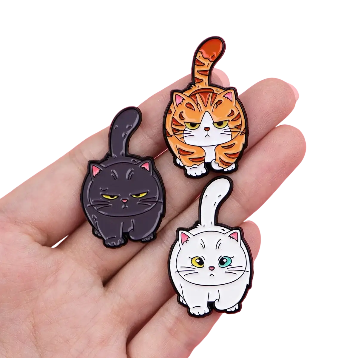 Cat enamel lapel pin set featuring three colorful cartoon cats in black, orange tabby, and white with vibrant eyes