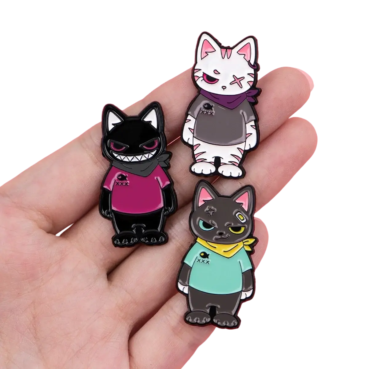 Cat enamel lapel pin set featuring three stylized pins in black, white, and dark gray with distinct colorful accessories