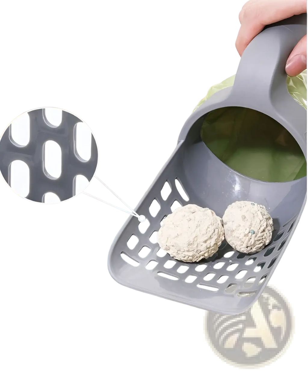 Gray plastic cat litter scoop with integrated bag dispenser and perforated sides holding two clumping pellets