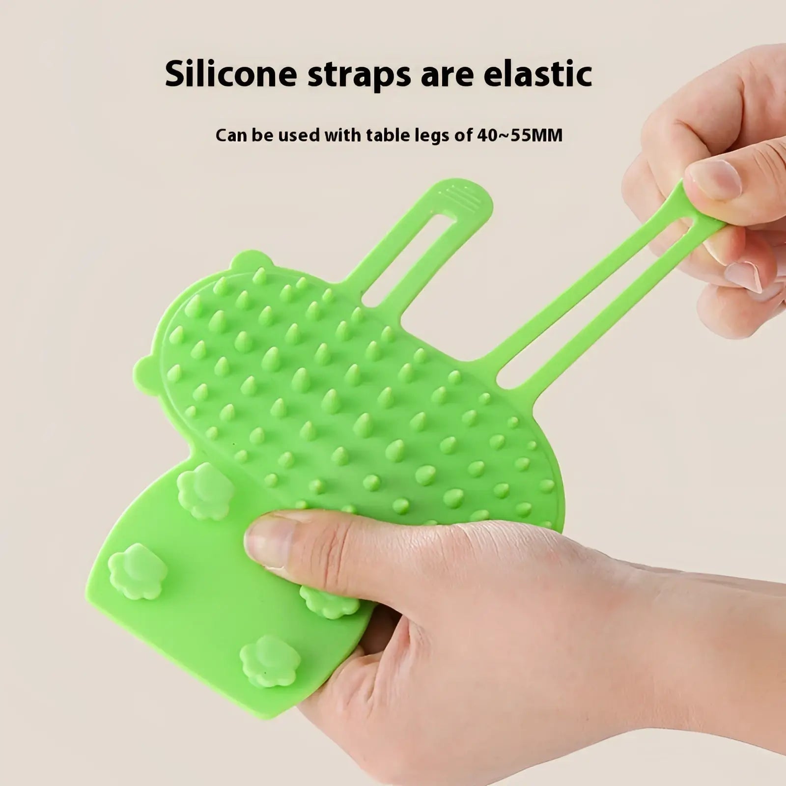 Bright green silicone cat massage comb with textured raised bumps and flower shaped grips for self grooming