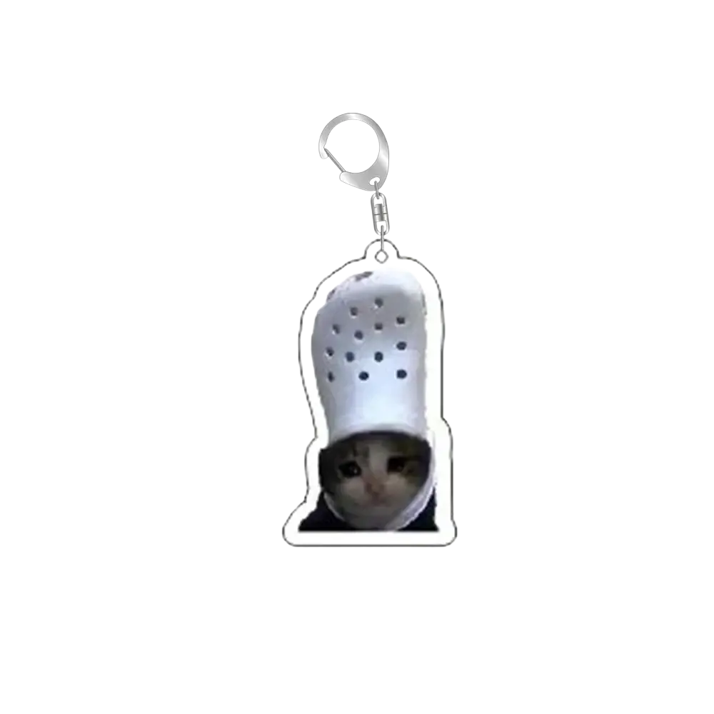 White acrylic cat meme keychain featuring a cat peeking from a black croc-style shoe with silver metal clip