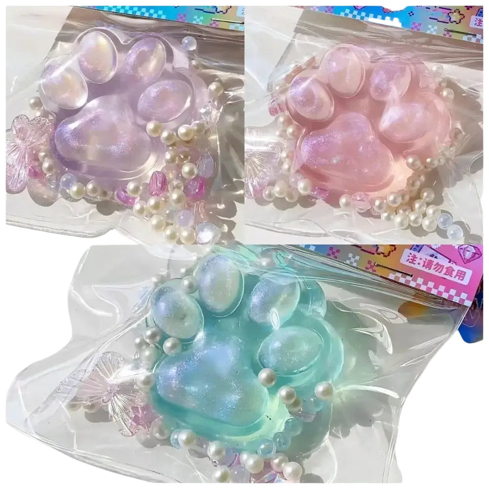Pastel-colored translucent cat paw squeeze toy made of silicone with pearls and beads for stress relief and sensory play
