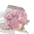 Pink glittery resin cat paw squeeze toy adorned with white pearls for silicone slow rising stress relief