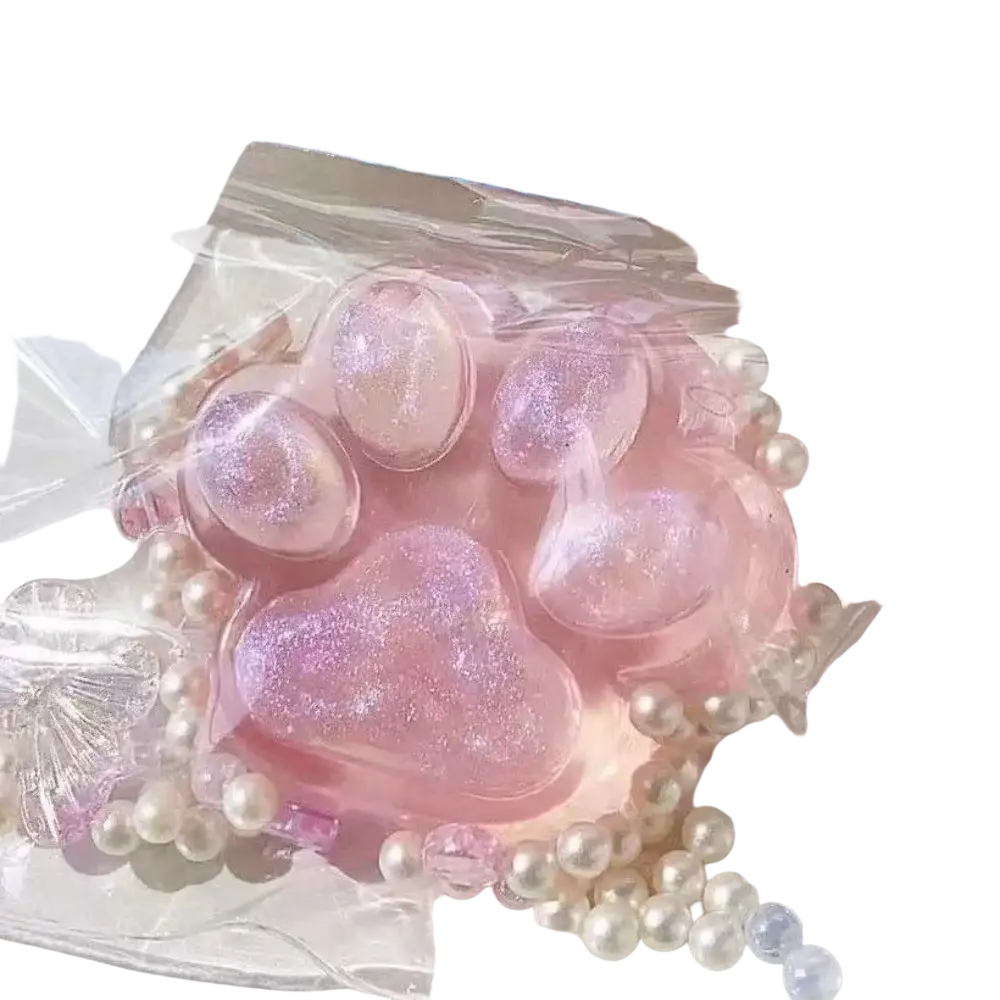 Pink glittery resin cat paw squeeze toy adorned with white pearls for silicone slow rising stress relief