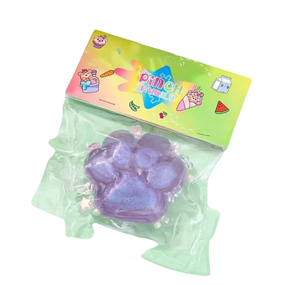 Purple glittery cat paw squeeze toy made of silicone in clear packaging for slow rising stress relief