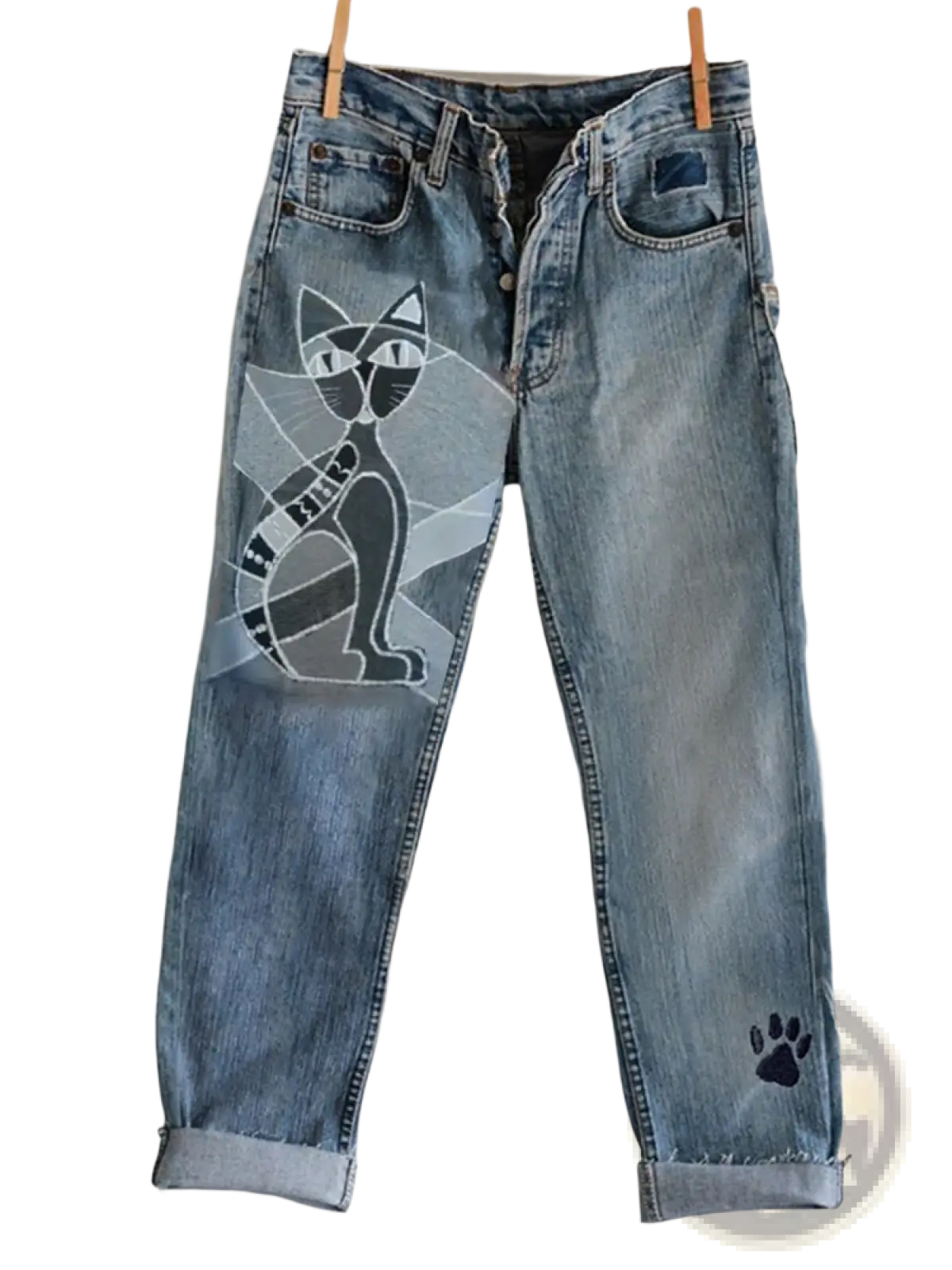 Light-wash faux denim flared trousers with a black and white stylized cat graphic and embroidered paw print on the left leg