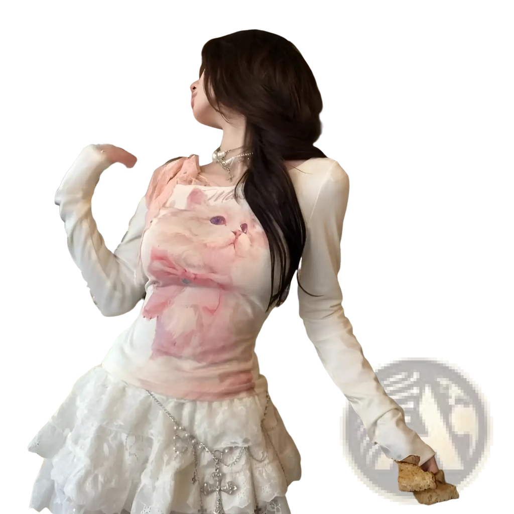 White long-sleeved top featuring a pink cat illustration and bow with lace halter detailing for stylish wear