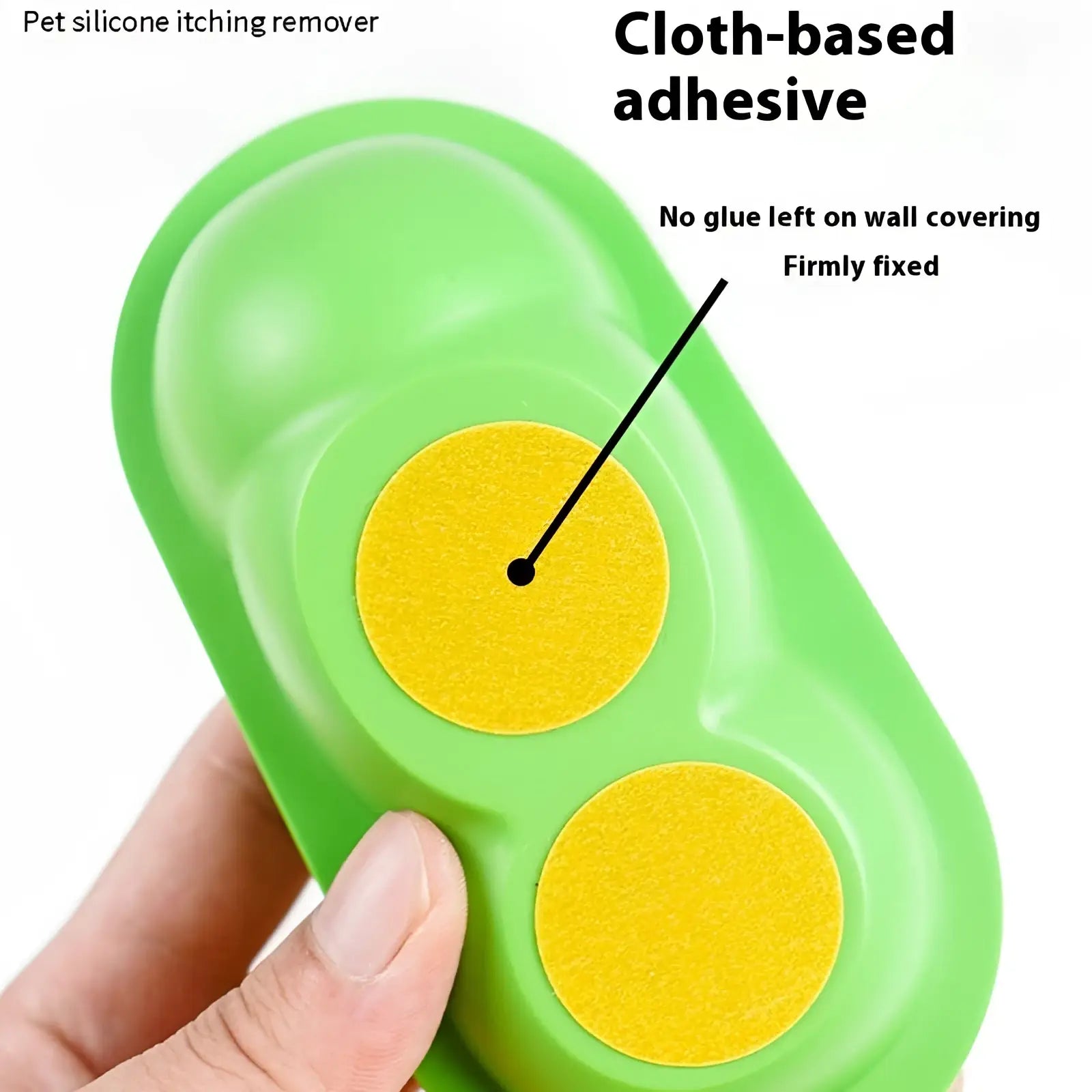 Green silicone cat self grooming brush and scratching toy with two yellow cloth adhesive pads for pet itching removal