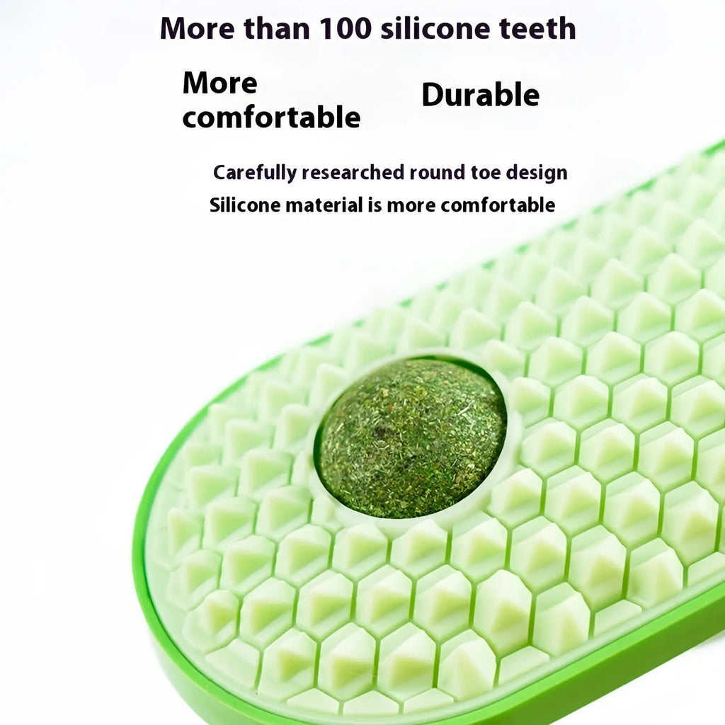 A lime green silicone shoe insole with honeycomb pattern and central textured pad for cat self grooming brush toy