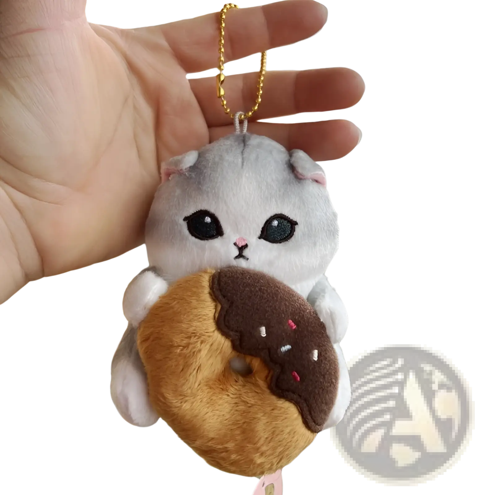A soft gray plush cat shark keychain with pink ears and embroidered eyes holding a chocolate frosted donut pendant