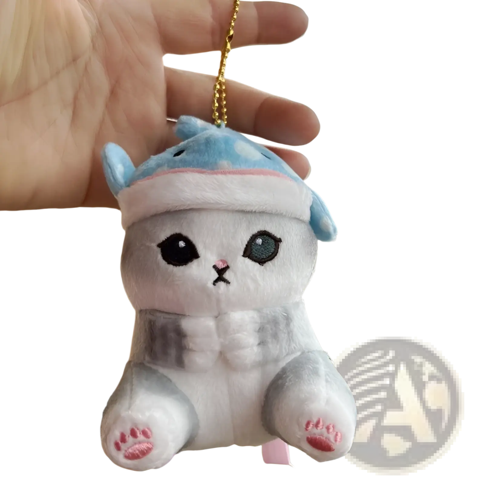 A plush white and gray cat shark keychain with blue ears, patterned hat, pink paw prints, and embroidered eyes