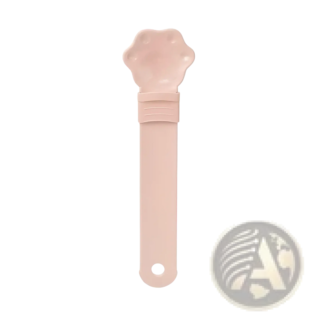 Pink plastic cat strip feeder pet grooming tool with paw-shaped head and smooth handle for easy grooming