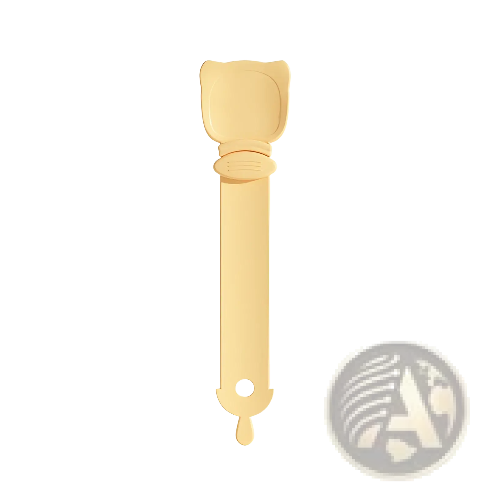 A pale yellow silicone cat treat squeezer and pet food spoon with a smooth rounded head and slender handle with hole