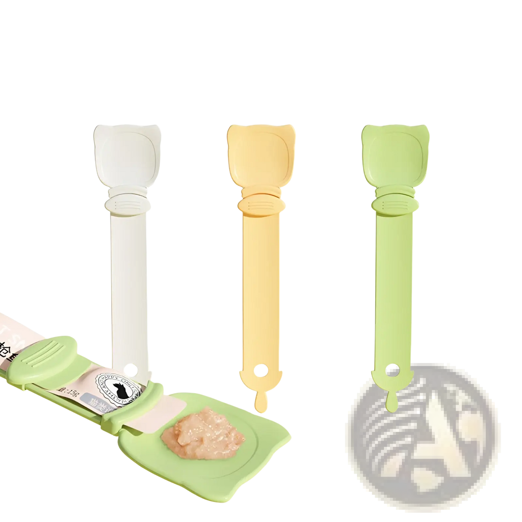 Set of three pastel-colored cat-shaped silicone pet food scoops in white yellow and green for feeding treats