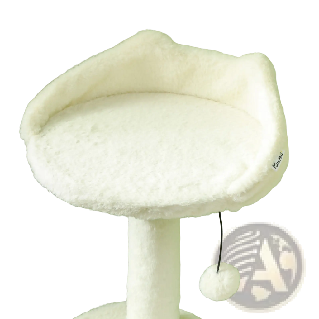 White plush cat bed with soft fluffy texture and dangling pom-pom toy attached to cat tree tower with scratching posts
