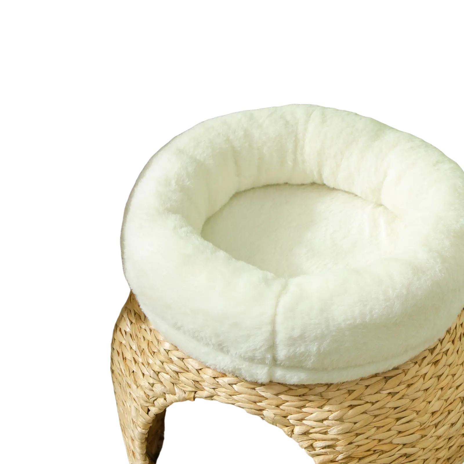 Cream-colored plush cat bed with woven wicker base in cat tree tower with scratching posts and beds for pets