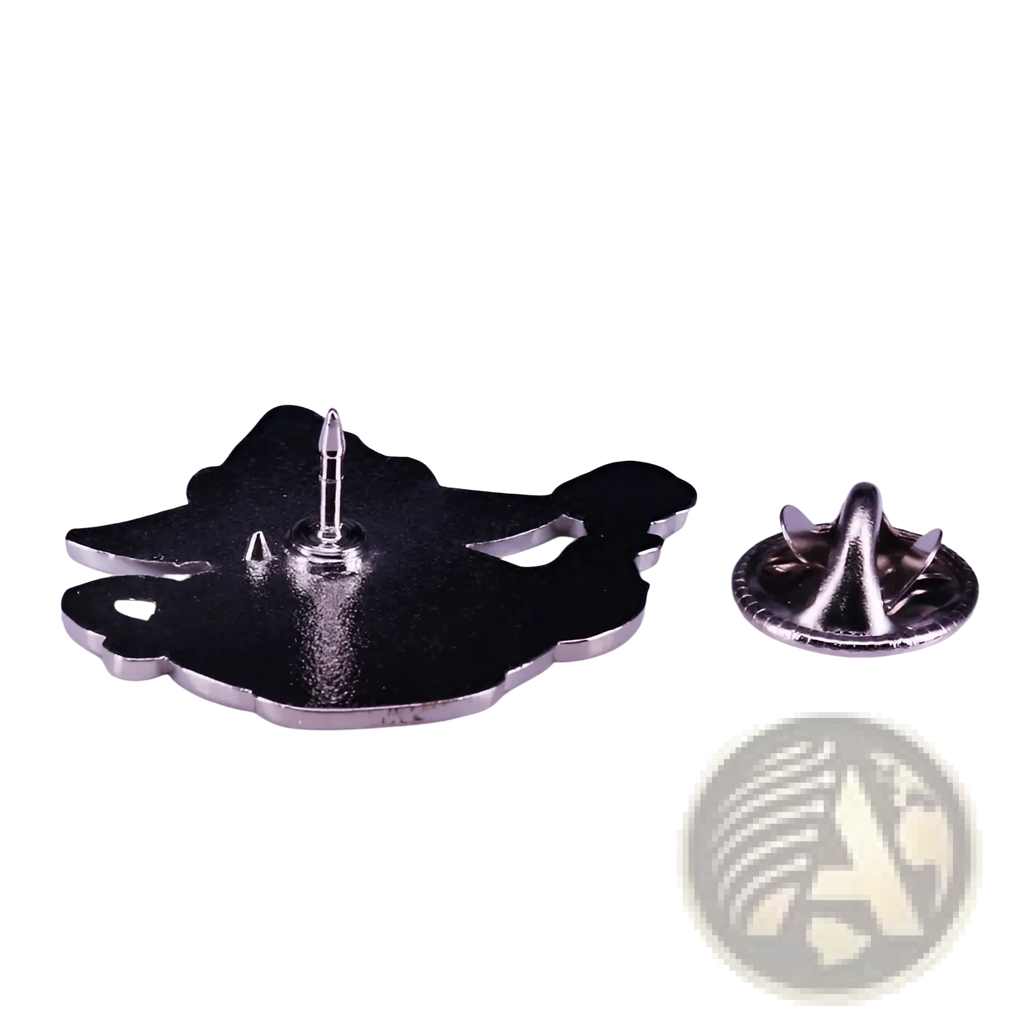 Black enamel pin shaped like a stylized cat with silver toned metal edges from the cat witch teapot whimsical copper brooch collection