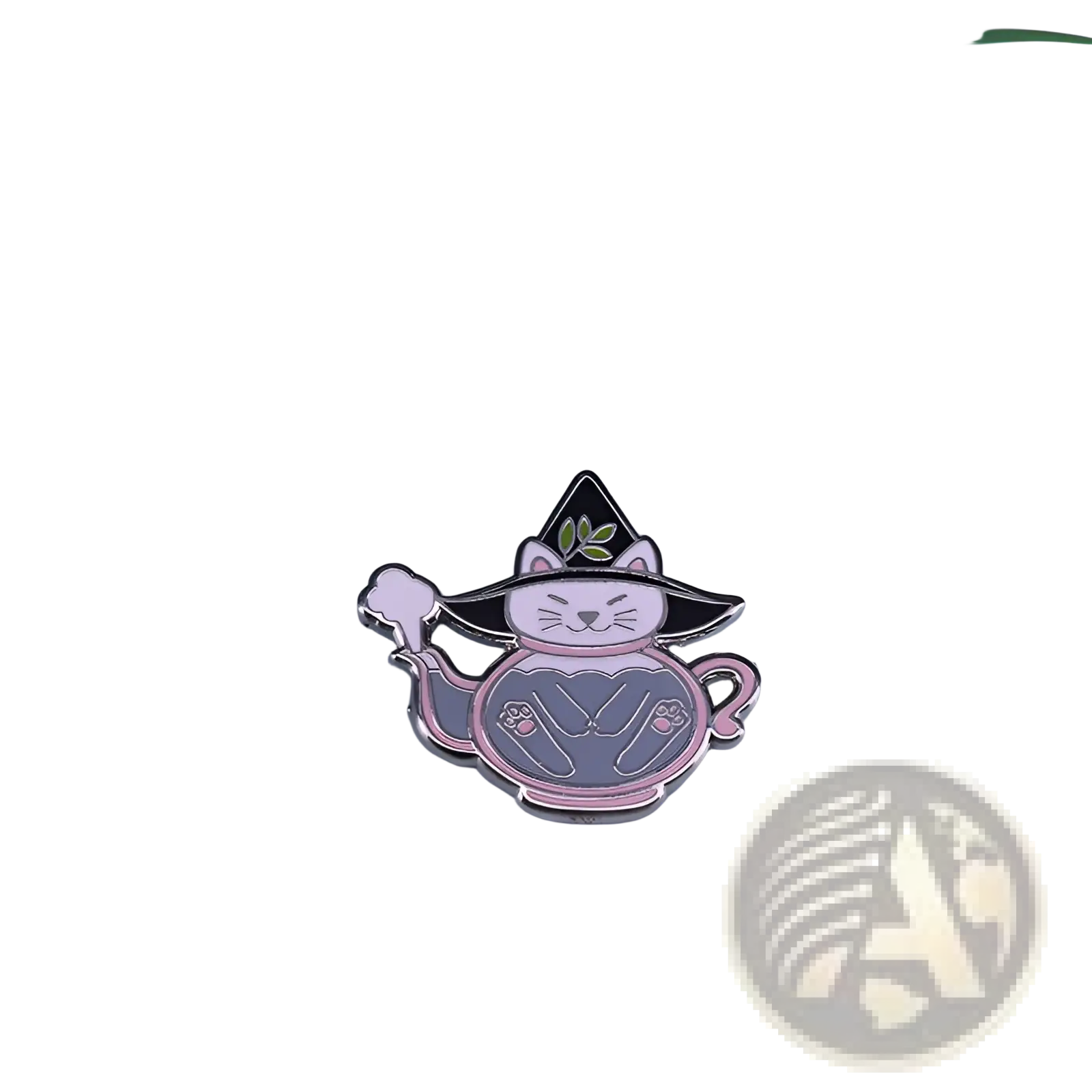 A whimsical copper enamel pin of a white cat in a black witch hat with green leaves inside a pink-outlined gray teapot