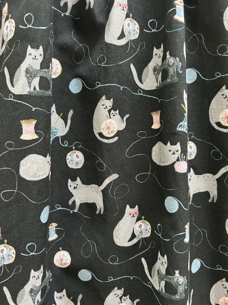 Black cotton cats and yarn vintage fit and flare midi dress with white cartoon cats sewing pattern