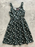 A dark green cotton cats and yarn vintage fit and flare midi dress with a playful white and gray cat pattern