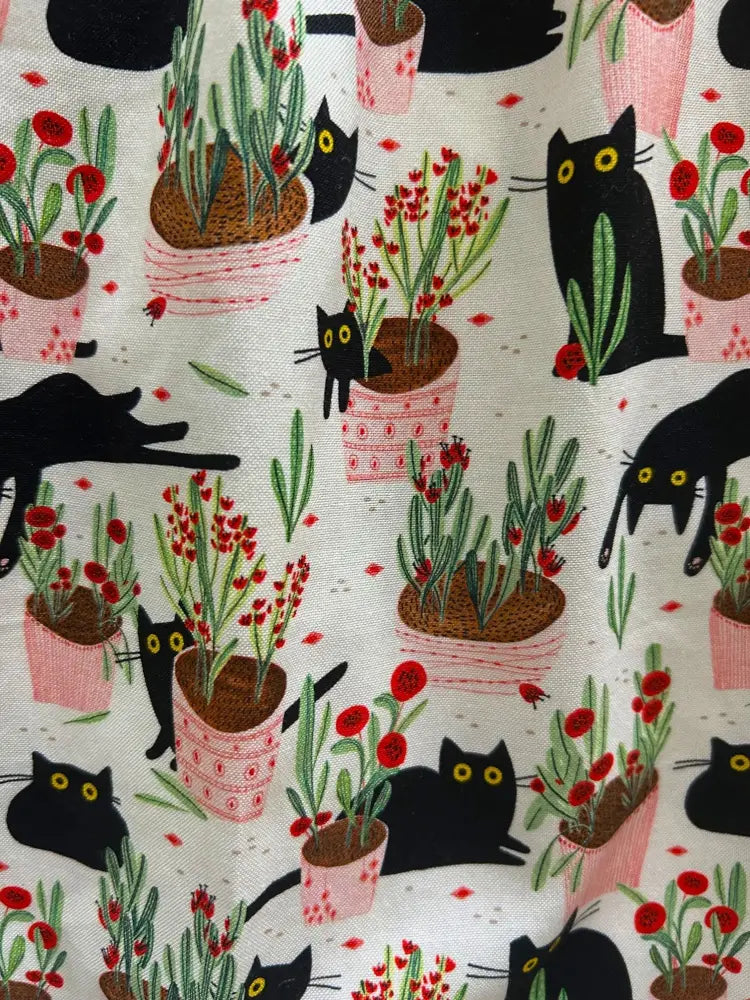 Cats and plants retro peter pan collar cotton dress with black cats yellow eyes and potted red flowers pattern on light pink fabric