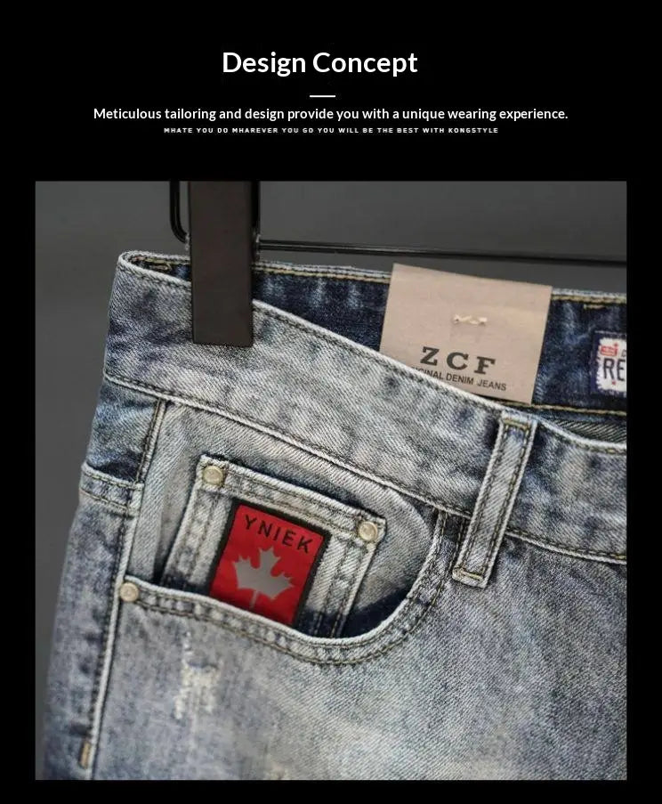 Light-wash denim distressed maple leaf denim shorts featuring a red maple leaf patch with ynik branding on the front pocket.