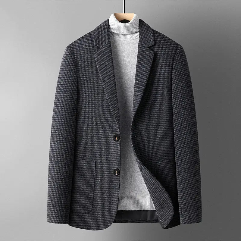 Men’s wool suit blazer slim fit winter jacket in dark gray herringbone-patterned wool with black buttons and a notched lapel.