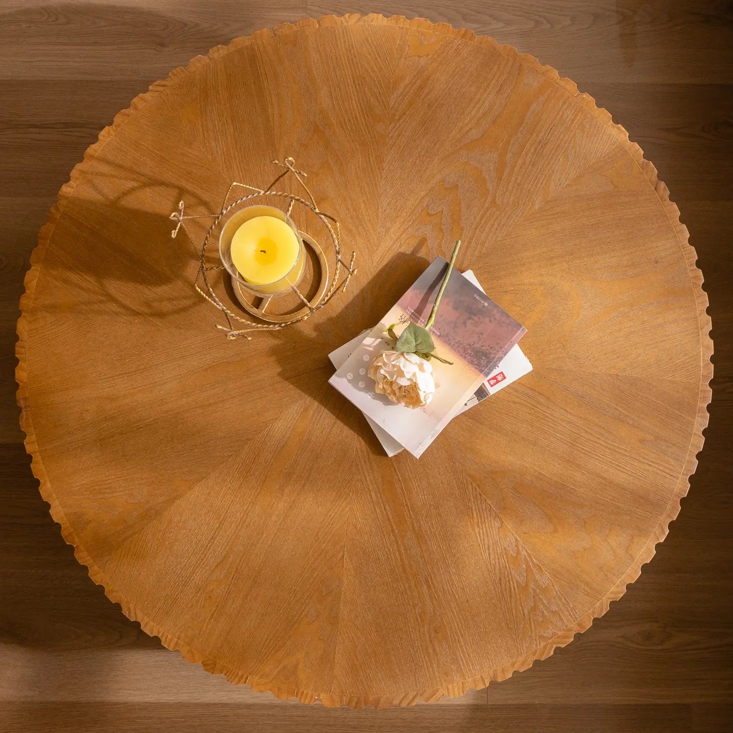 A round retro coffee table with a scalloped edge and fluted wood top in a warm natural finish.