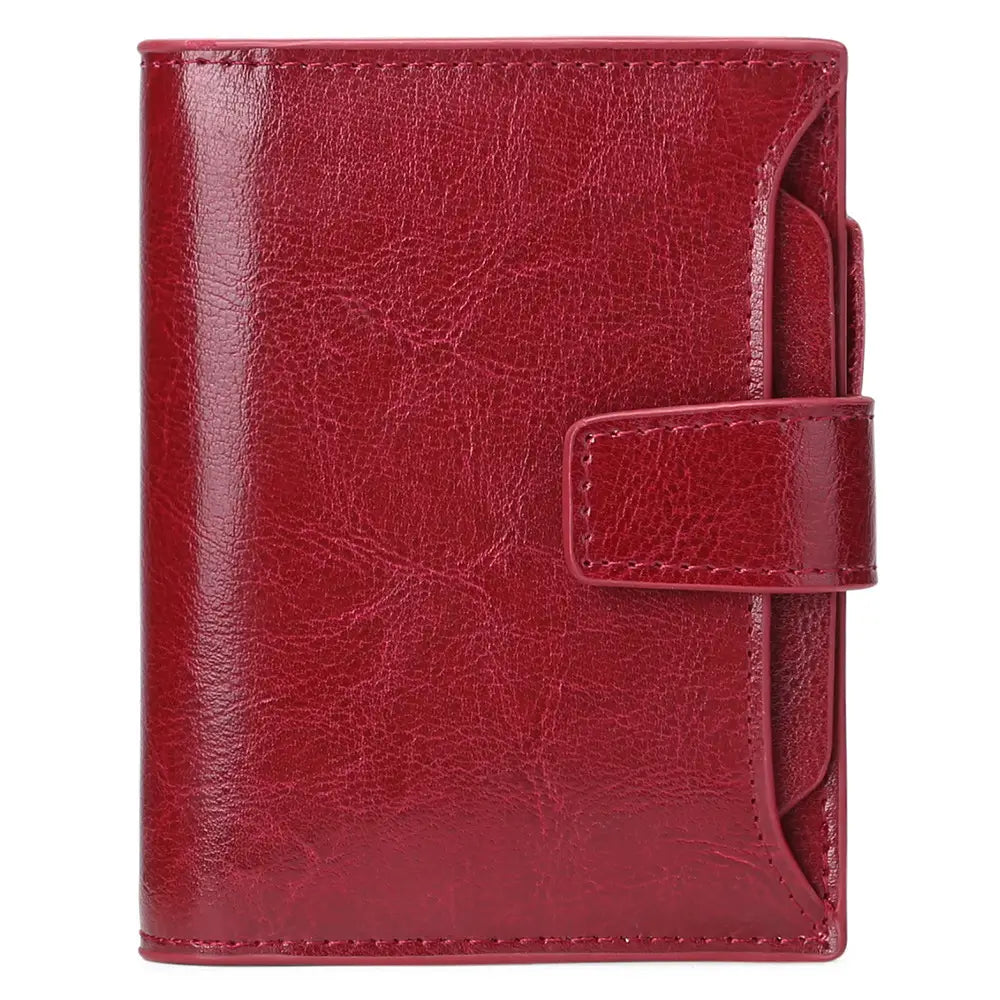 A rich burgundy leather RFID wallet with textured surface and matching stitched flap closure featuring a zipper and anti theft protection.