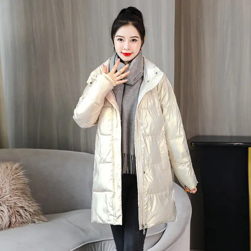 A shiny cream-colored puffer coat with a quilted design and a high collar featured in a glossy black plus size puffer jacket product.
