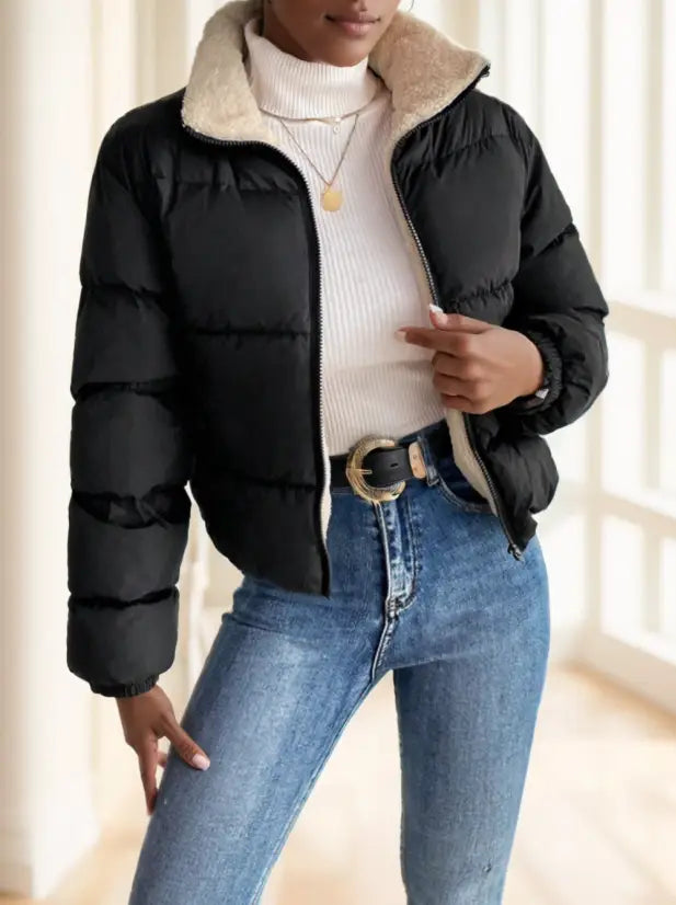 Black reversible fleece puffer jacket featuring a plush beige shearling collar and quilted design in off white.
