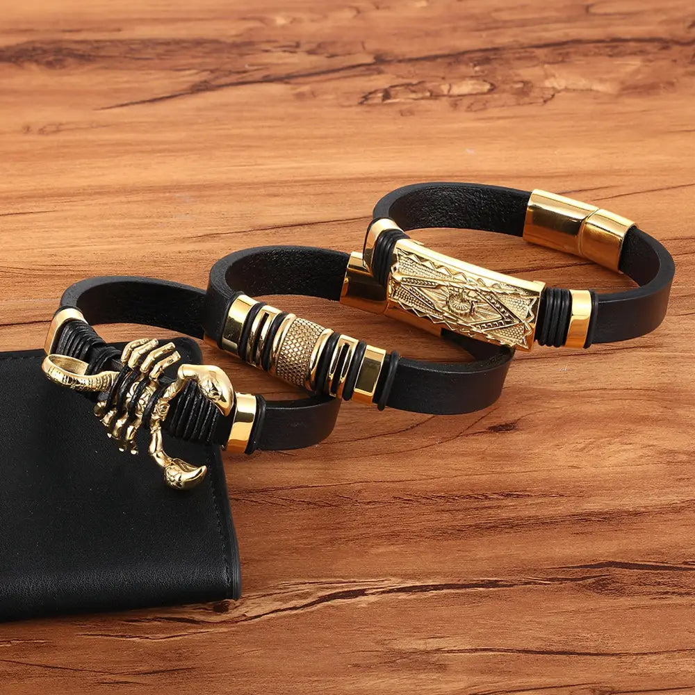 black leather scorpion bracelet with gold magnetic clasp featuring gold-tone metal accents and detailed geometric designs