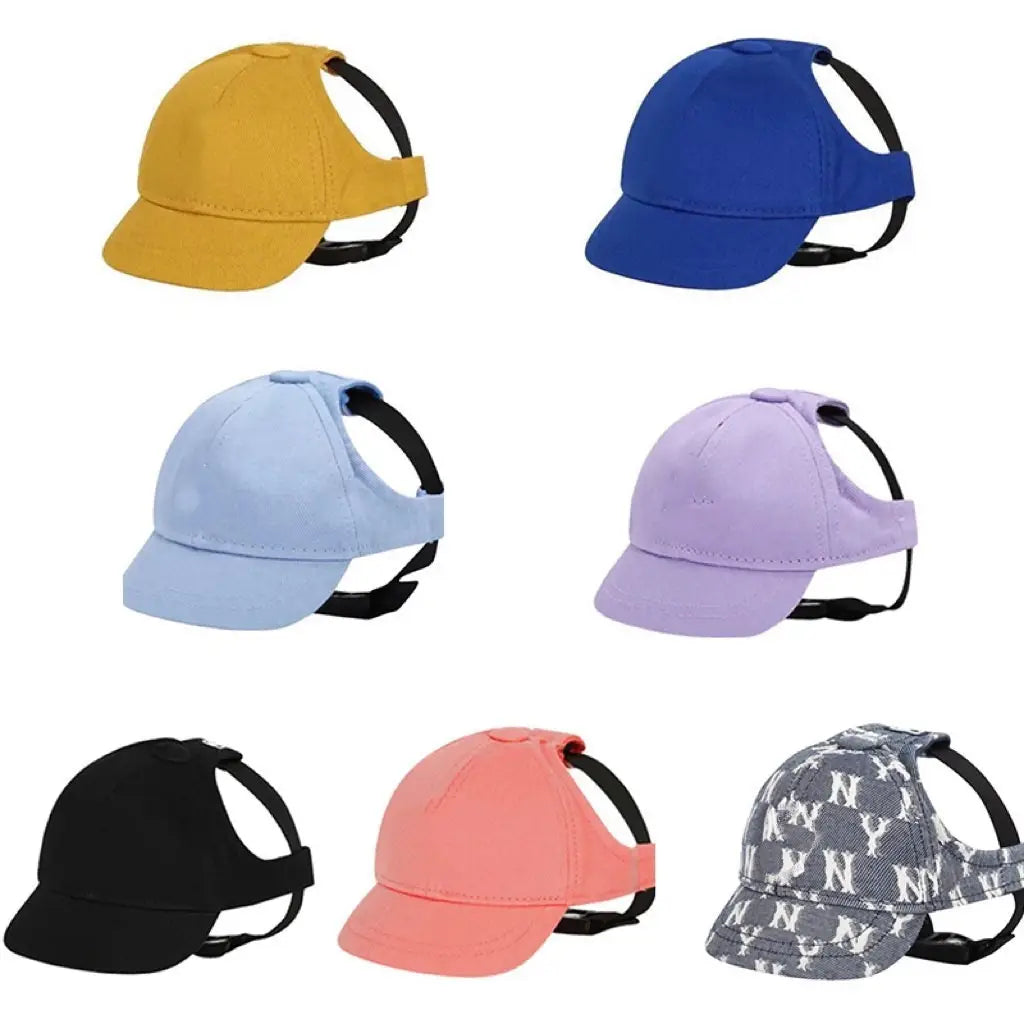 Adjustable sun proof pet hats in various solid colors and one gray ny logo pattern, each with black straps and ear holes for a secure fit.