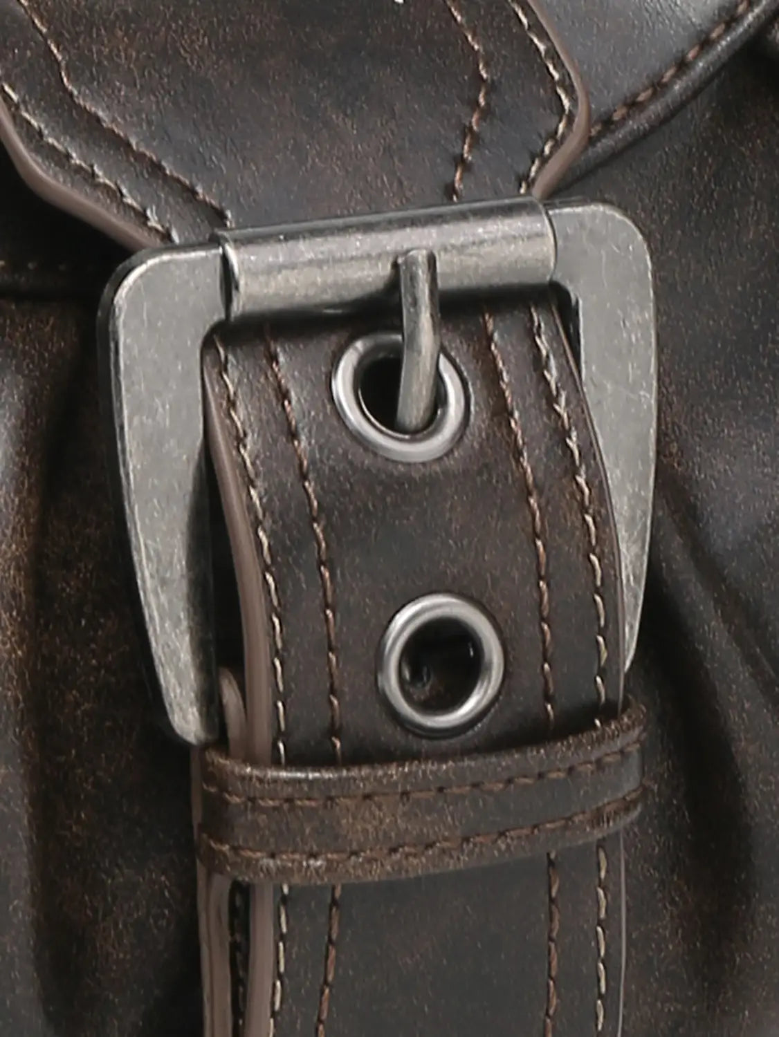 Vintage leather shoulder bag with dark brown leather strap featuring a silver toned metal buckle and matching stitching.
