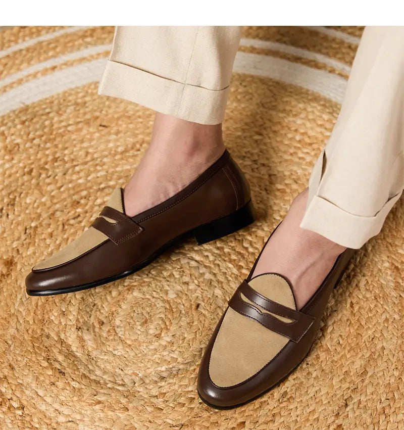 Brown and beige two-tone leather loafers with a classic slip-on design featuring a block heel in British style.